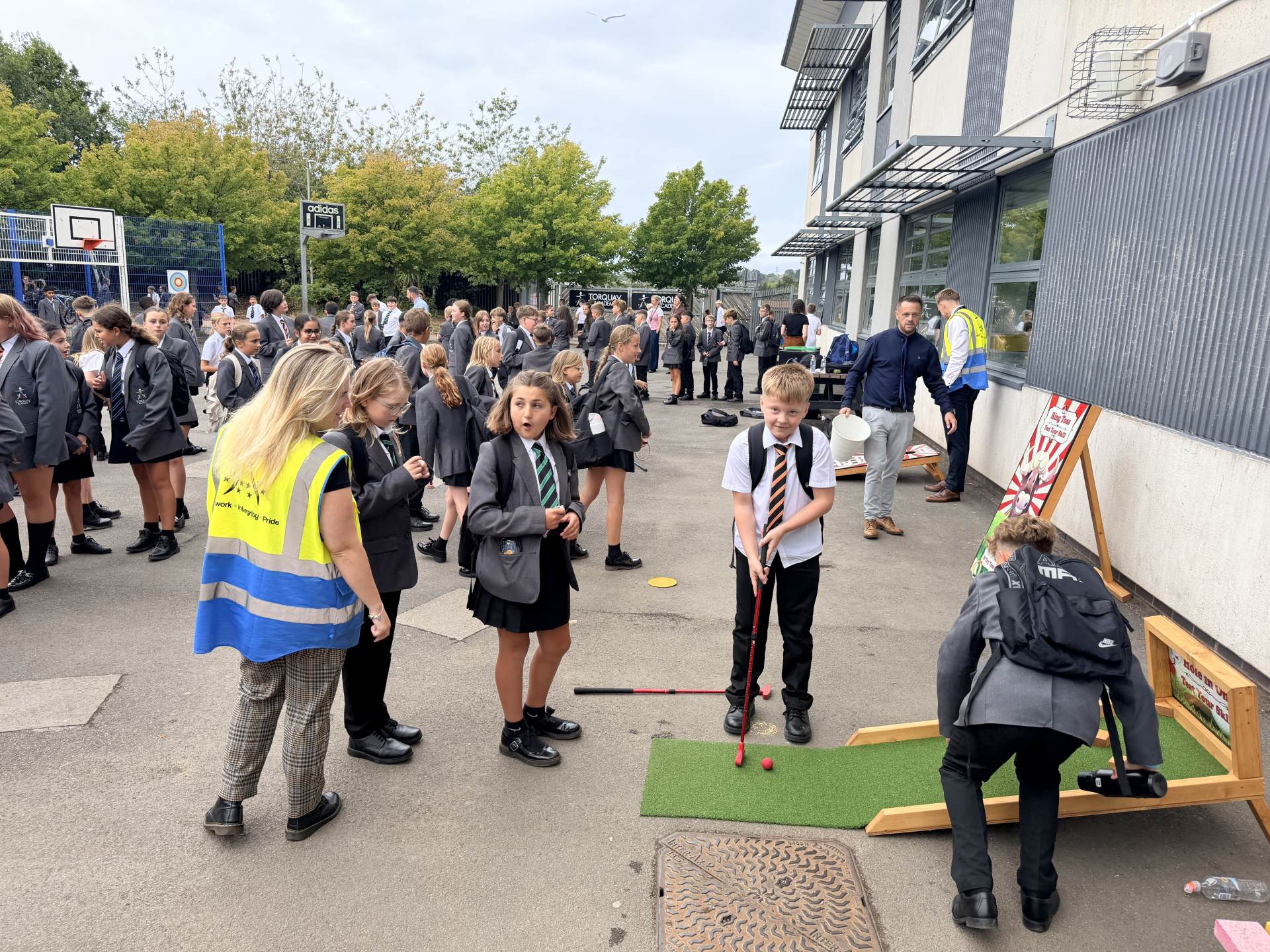 Year 7 students enjoying the putting challenge with staff