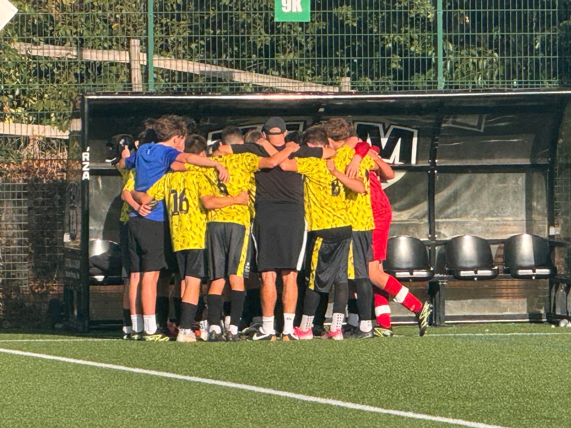 Year 11 boys&rsquo; football team in a huddle